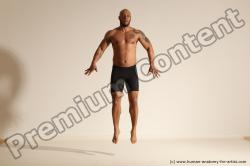 Underwear Gymnastic poses Man Black Muscular Bald Dancing Dynamic poses Academic